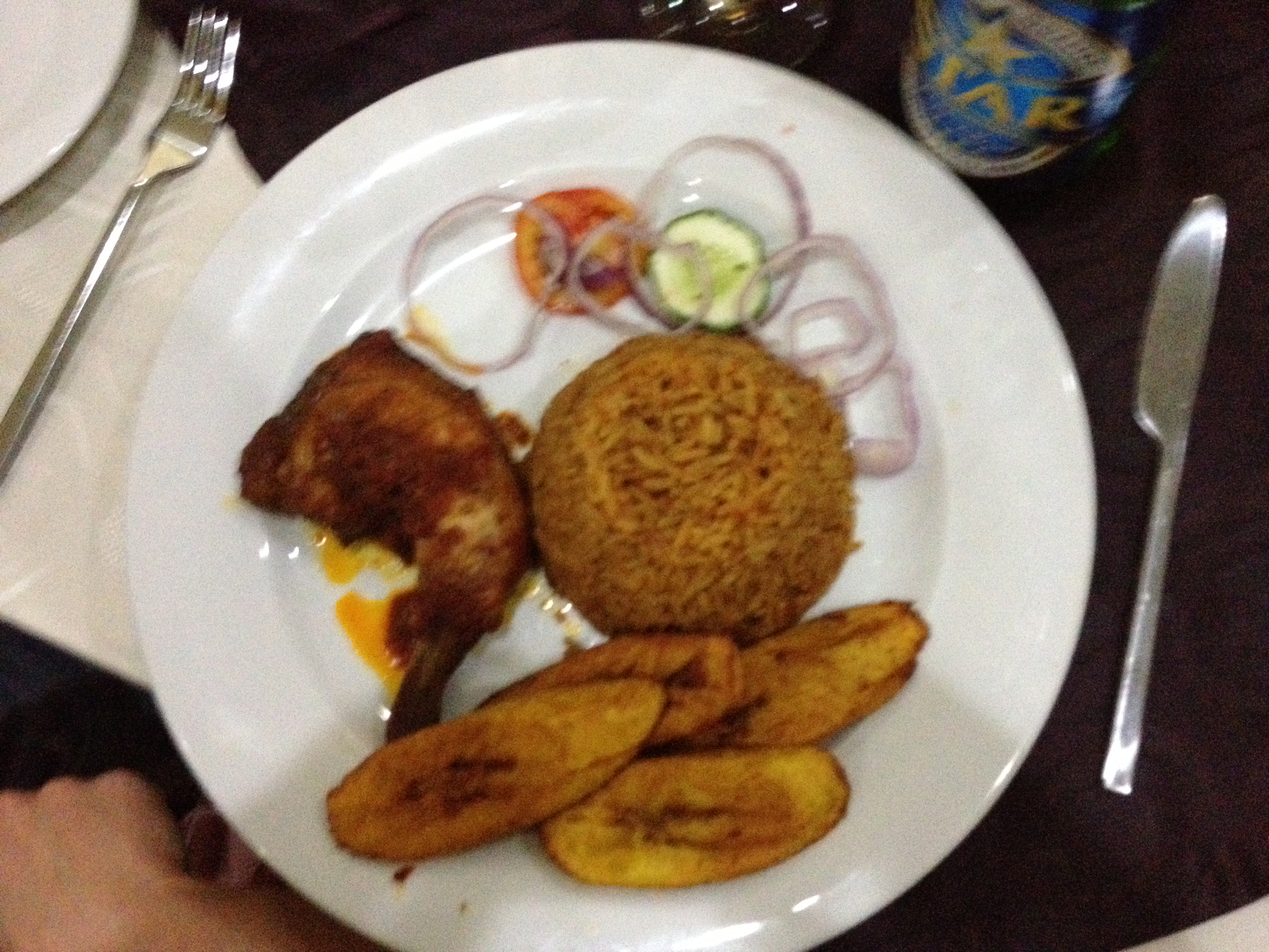 Jollof Rice with chicken and plantain. Nigerian food is kinda spicy :)