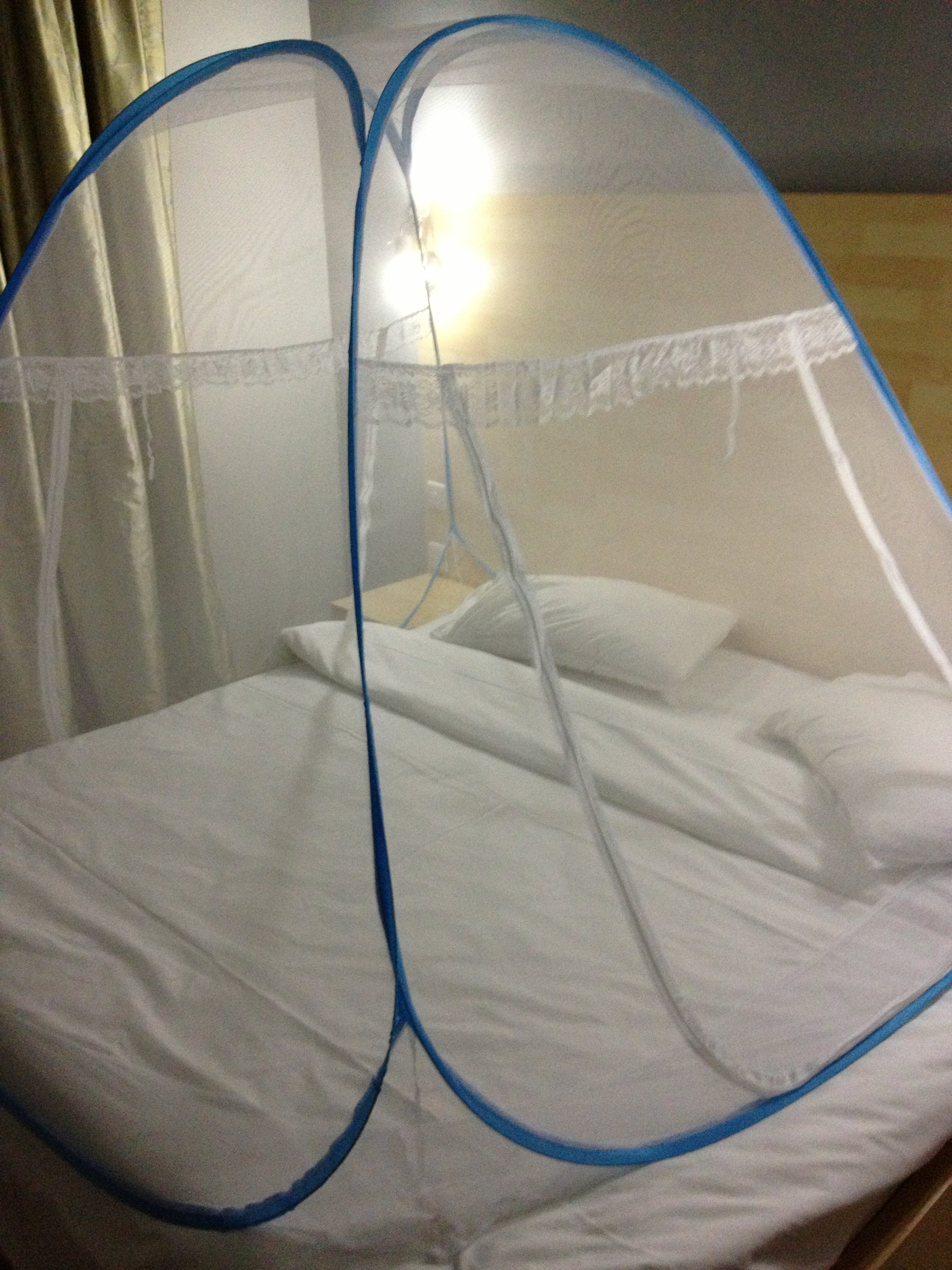 Mosquito net over the bed...it reminds me of my G.I. Joe tent as a child :)